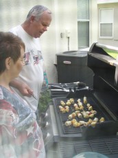 Mom and my uncle oversee the grill