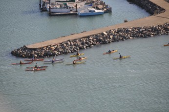 Kayakers leaving a marina