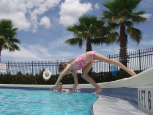 Ashlyn, the more graceful of the two, took to some more traditional dives
