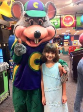 Adrienne posing with Chuck E. Cheese