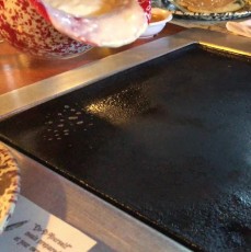Pouring pancake batter onto the in-table griddle