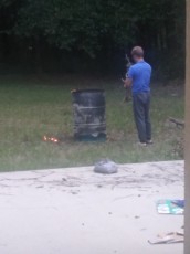 There's nothing like coming home to burning branches in a can in the back yard