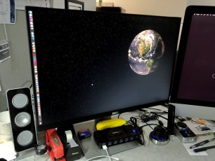 The ancient Apple Cinema HD Display has been replaced by a Dell UltraSharp U2415 LED monitor—half as thick, much tinier bezel, and, at long last, adjustable height!