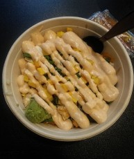 A rice bowl with white sauce and wasabi; yum!